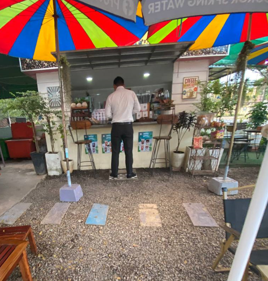 A regular customer stopping by for his afternoon coconut coffee break.