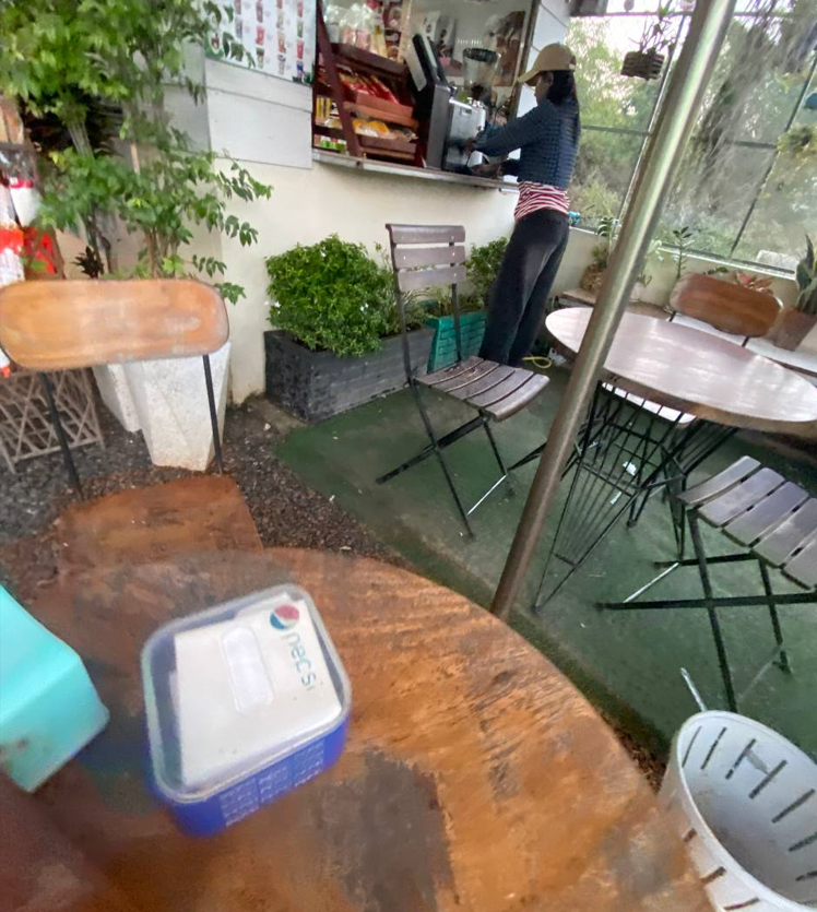 The Press Day Coffee shop counter and barista in Battambang.