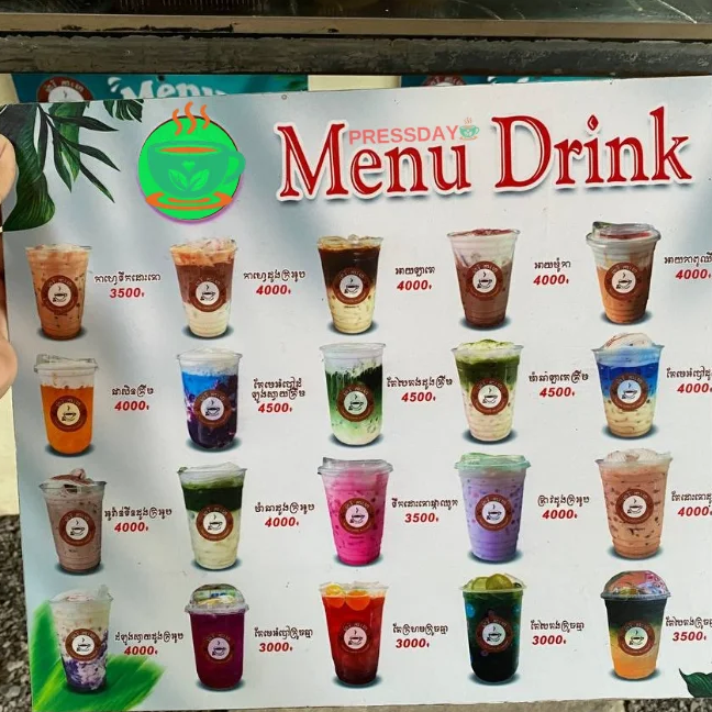 The Press Day Coffee menu board showing drinks priced at 4000 riel in Cambodia.